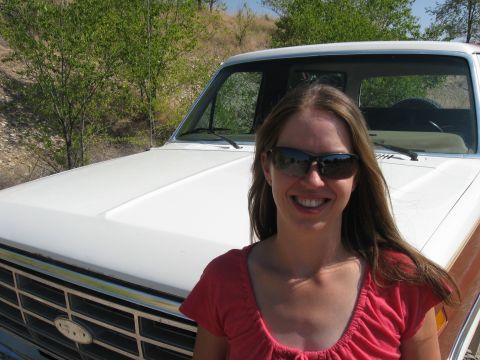 1981 Ford Bronco - A woman poses in front of a white Ford truck, likely from the early 1980s.