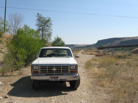 1981 Ford Bronco - This 1980 Ford Bronco is parked on a dirt road with a bridge visible in the distance.