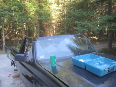1993 Ford Bronco - This 1993 Ford Bronco appears to be a convertible, with blue storage bins placed on its hood.