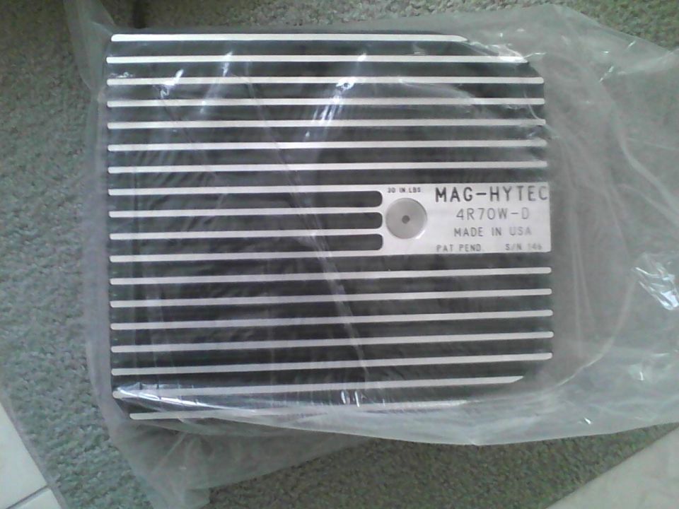 MAG-HYTEC 4R70W-D transmission pan in plastic packaging, with "MADE IN USA" and "PAT PEND."