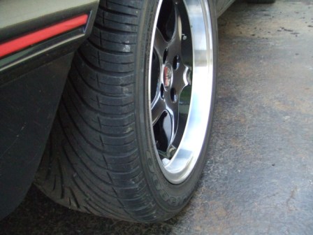 1996 Ford Bronco - Detail shot of a custom wheel and tire assembly on a vehicle.