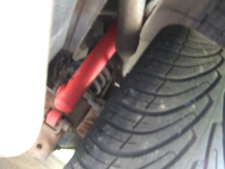 1996 Ford Bronco - The rear suspension and tire are visible in this close-up shot.