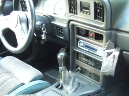 1996 Ford Bronco - The interior of a car is shown, the dashboard, steering wheel, and center console.
