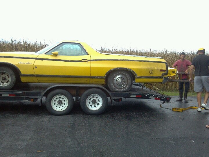 1974 Ford Ranchero on a trailer being loaded, side view