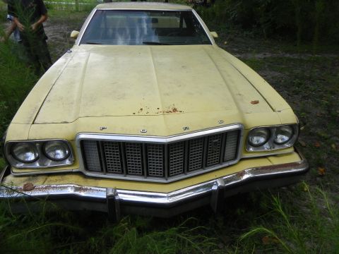 1974 Ford Ranchero - Front view of a yellow 1974 Ford Ranchero with a prominent grille and chrome bumper.