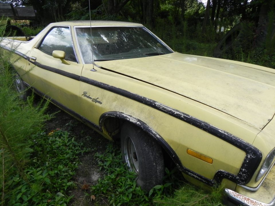 Yellow 1974 Ford Ranchero with "Ranchero" script on fender