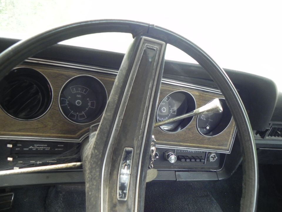 1974 Ford Ranchero interior dashboard with wood grain trim and gauges