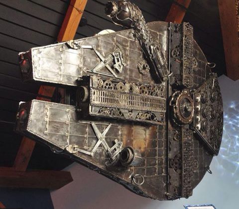 2007 Ford Mustang - This intricate sculpture is made from various metal parts and gears, resembling the iconic Millennium Falcon.