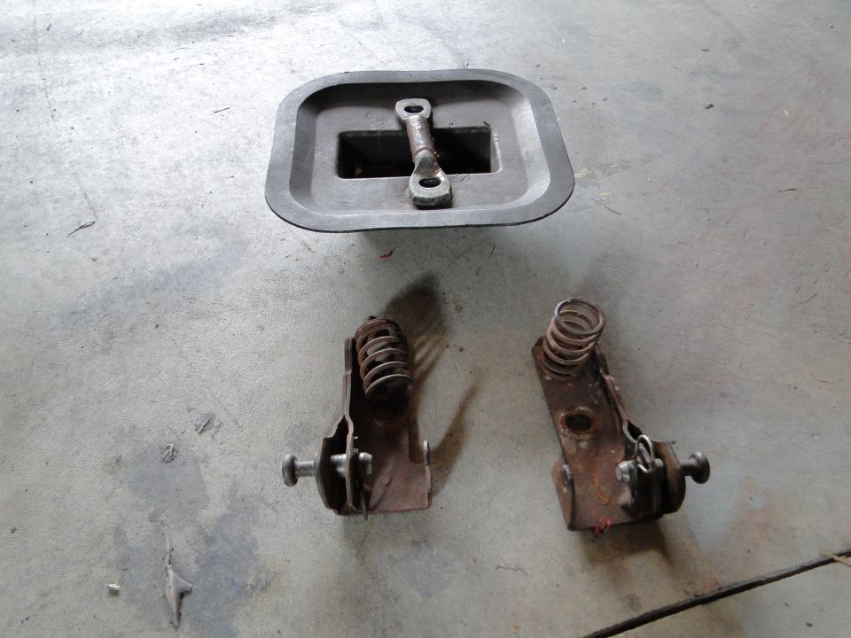 Hood latch assembly and springs