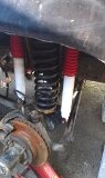 1979 Ford Bronco - Close-up view of rear axle suspension components, including shocks and springs.
