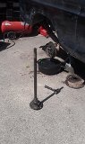 1979 Ford Bronco - Rear axle assembly removed from a vehicle for service, with tools and parts laid out.