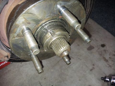 1994 Ford Ranger - This image shows a close-up view of a vehicle's wheel hub assembly, including the lug bolts and axle shaft.