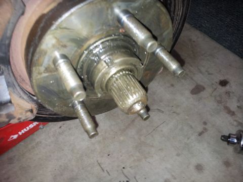 1994 Ford Ranger - Close-up of a vehicle's wheel hub assembly, showing grease and lug studs.