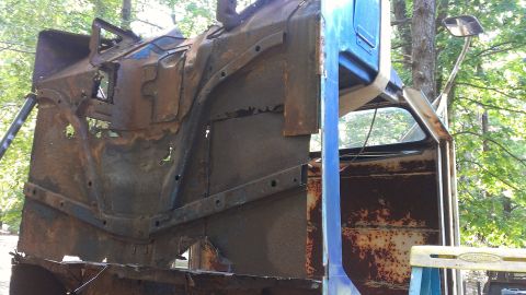 1978 Ford Bronco - This heavily rusted truck cab is missing many of its body panels and appears to be in a state of disrepair.