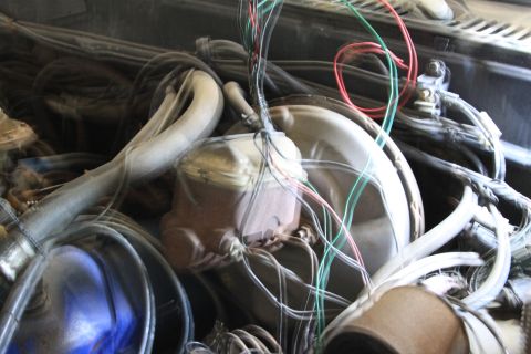 1979 Ford F-350 - Close-up view of complex wiring and components within a vehicle's engine bay.