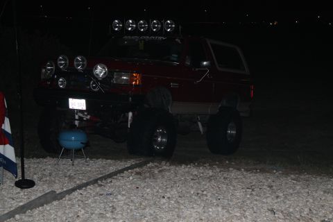 1990 Ford Bronco - Red 1990 Ford Bronco equipped with numerous auxiliary lights for off-road use at night.