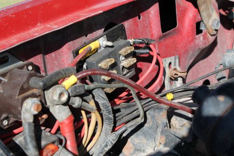 1990 Ford Bronco - Engine bay wiring and fuse box detail, showing various electrical connections and components.