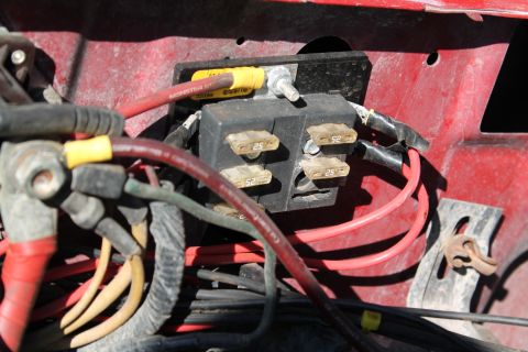 1990 Ford Bronco - This image shows a close-up view of a vehicle's electrical fuse box and wiring.