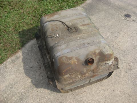 1994 Ford Bronco - This is a used fuel tank, likely for a vehicle, shown outdoors on a concrete surface.