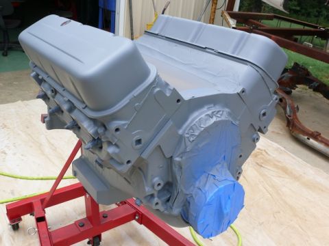 1968 Chevrolet Camaro - Engine block is prepped and masked for painting, resting on a red engine stand.