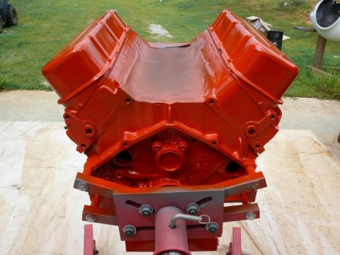 1968 Chevrolet Camaro - A freshly painted V8 engine block sits on a stand, ready for assembly.