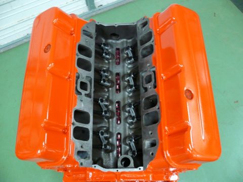1968 Chevrolet Camaro - V8 engine block with orange painted valve covers and visible internal components.