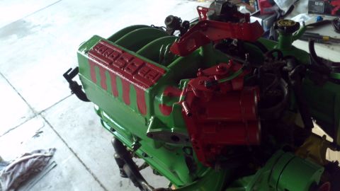 1987 Ford Bronco - Engine block painted green with red "FORDSPEED" lettering and red accents, possibly a Ford Bronco engine.