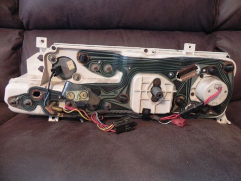 1974 Ford Ranchero - The rear of a vehicle's instrument cluster shows its internal wiring and circuit board connections.