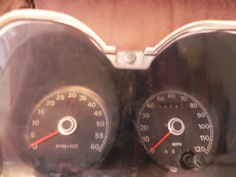 1974 Ford Ranchero - Dashboard gauges, including a tachometer and speedometer, are visible in this close-up view.