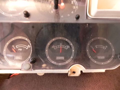 1974 Ford Ranchero - Close-up of a vehicle's dashboard gauges, showing oil pressure, amperage, and temperature readings.
