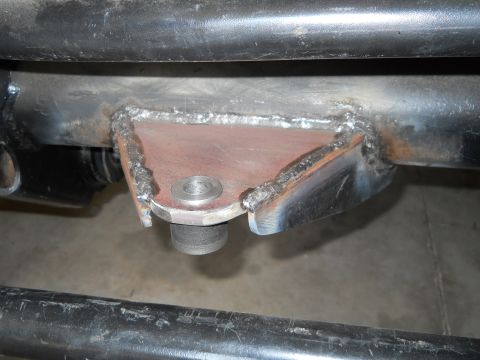 1992 Ford Bronco - Close-up view of a custom welded bracket attached to a vehicle's frame, a bolt head.