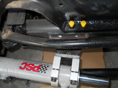 1992 Ford Bronco - Close-up view of vehicle undercarriage components, including a PSC steering cylinder.