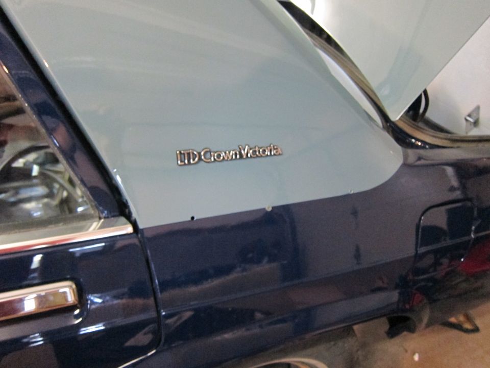 Two-tone dark blue and light blue 1991 Ford Crown Victoria LTD side detail with badge