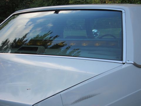 1991 Ford LTD Crown Victoria - Rear view of a 1991 Ford Crown Victoria LTD, showing the back window and part of the trunk.