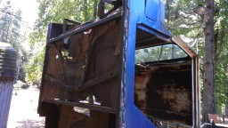 1978 Ford Bronco - This heavily rusted vehicle body shell shows significant damage and decay.