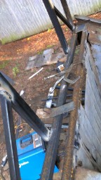 1978 Ford Bronco - Metal frame construction and welding equipment are visible in an outdoor setting.