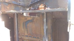 1978 Ford Bronco - Close-up view of heavily rusted and damaged vehicle body panels.