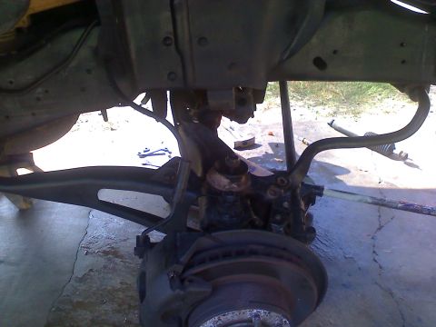 1990 Ford Bronco - Undercarriage view of a vehicle's suspension and brake components, with a watermark from Supermotors.net visible.