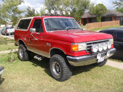 1990 Ford Bronco - This red 1990 Ford Bronco is equipped with auxiliary lights on the roof and bumper.