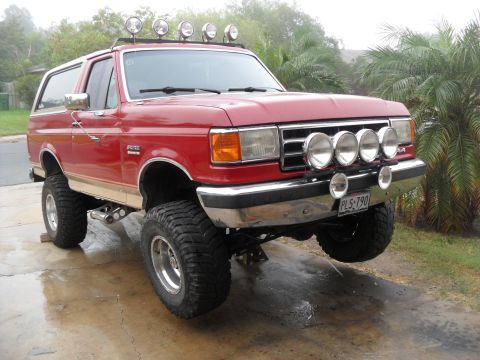 1990 Ford Bronco - This lifted 1990 Ford Bronco is equipped with multiple off-road lights on the roof and front bumper.