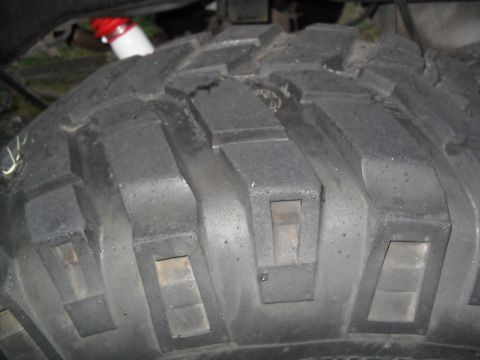 1990 Ford Bronco - The tread pattern on this off-road tire features large, blocky lugs for maximum grip.