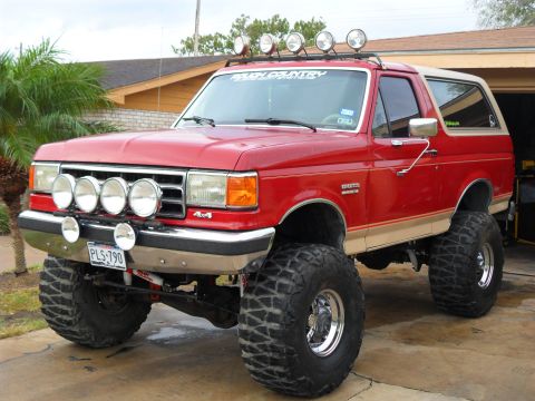 1990 Ford Bronco - This modified 1990 Ford Bronco features a significant lift kit and multiple auxiliary lights.