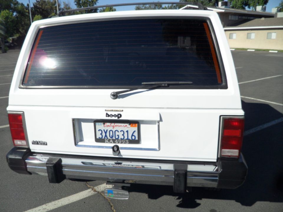 White 1994 Jeep Cherokee rear with California license plate 3XQG316