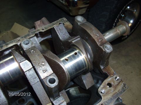 1979 Ford F-150 - Close-up of engine internals, showing crankshaft and connecting rods during a teardown.