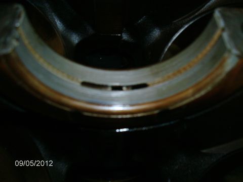 1979 Ford F-150 - Close-up view of an engine bearing, showing oil passages and wear.
