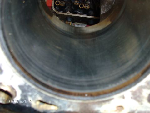 1979 Ford F-150 - Close-up view of an engine cylinder bore, showing wear patterns and the top of the cylinder head.