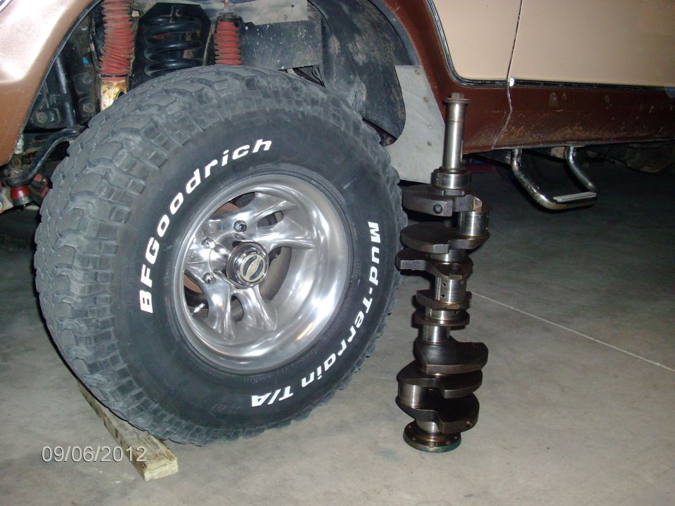 Crankshaft next to BFGoodrich Mud-Terrain T/A tire on 1979 Ford F-150