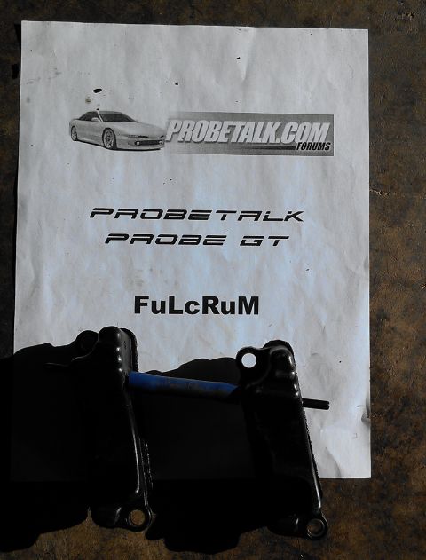 1995 Ford Probe - Document related to a Ford Probe GT, with a car part shown in front.