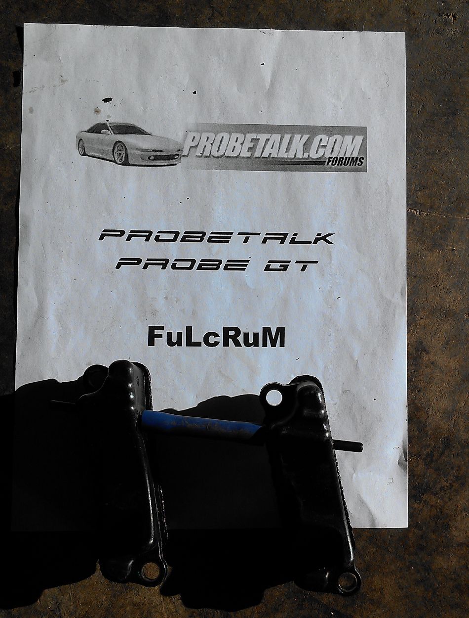 ProbeTalk.com Probe GT FuLcRuM printed sale sheet on concrete with black brackets laid across it