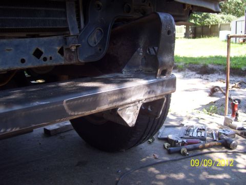 1990 Ford Bronco - Close-up of custom bumper fabrication with tools laid out nearby.